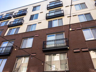 view of a Seattle apartment building, with strings of lights hung up below