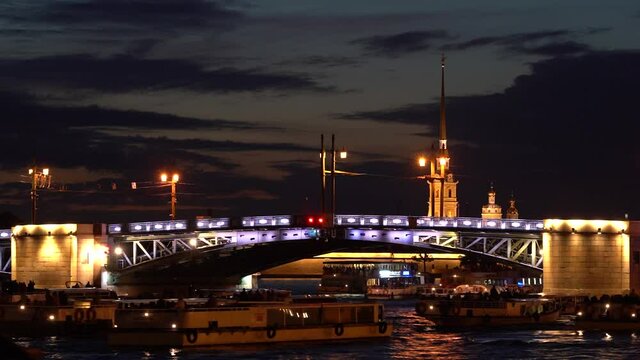 Timelapse the Divorcing Palace Bridge at night in St. Petersburg and passing ships