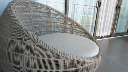 Outdoor beach chair on the hotel room balcony or terrace which made from natural wood called rattan...