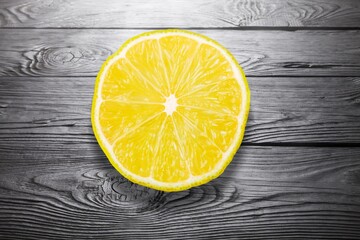 Juicy yellow lemon slice on a background