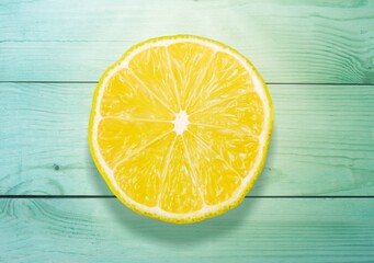 Juicy yellow lemon slice on a background