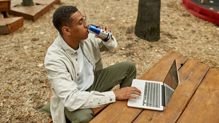 Young african american man with energy drink