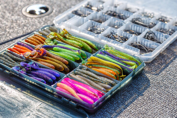 Fishing tackles and fishing baits in box .Classic Colored Fishing Lure , Beautiful Background...