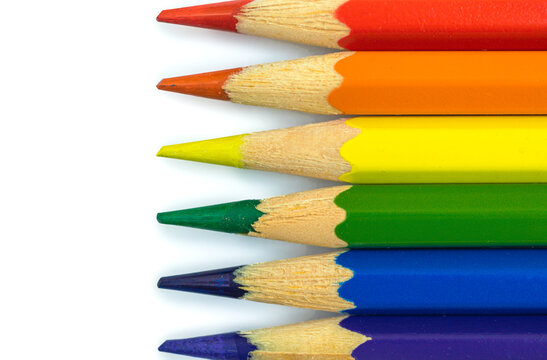 Creative stock photo of LGBT flag, color pencils on white table background, gay and lesbian community, concept of sexual minorities and tolerance