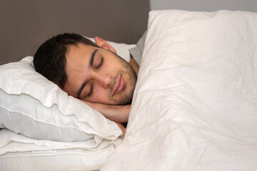 Fototapeta na wymiar portrait young man sleeping in bed