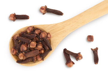 Dry spice cloves in wooden spoon isolated on white background with clipping path. Top view. Flat lay