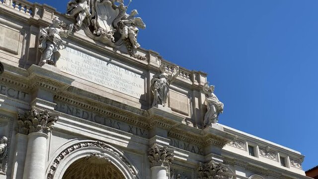 The facade of the Trevi Fountain in Rome with the Ocean Statue in the central niche