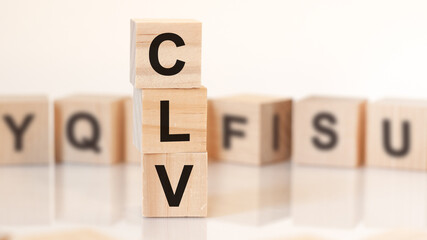 word CLV from wooden blocks with letters, concept