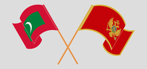 Crossed and waving flags of Maldives and Montenegro
