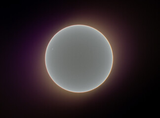 Glowing sun with sunspots