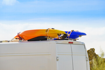 Van with canoe on top roof