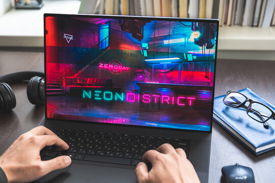 Russia Moscow 30.05.2021.Logo, screenshot of blockchain nft ethereum cryptocurrency kiber punk game Neon District in laptop screen. Man playing,collecting cards. Earning tokens, digital money at home
