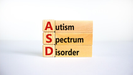 ASD, autism spectrum disorder symbol. Wooden blocks with words 'ASD, autism spectrum disorder'. Beautiful white background. Medical and ASD, autism spectrum disorder concept. Copy space. - obrazy, fototapety, plakaty