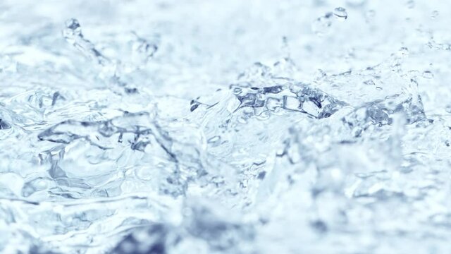 Super Slow Motion Shot of Waving and Splashing Blue Clear Water Surface at 1000fps.