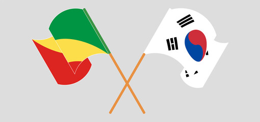 Crossed and waving flags of Republic of the Congo and South Korea
