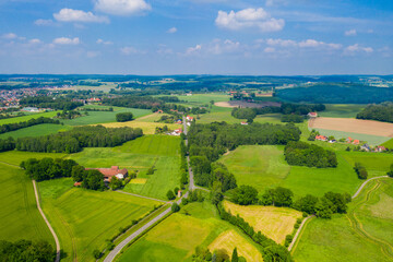 Fototapeta na wymiar Aerial view from the drone of landscape of the German countryside. Agricultural fields, villages, and woodlands.
