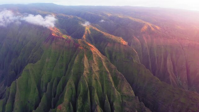 Cinematic sunset over scenic Na Pali coast green jungle mountains landscape 4K