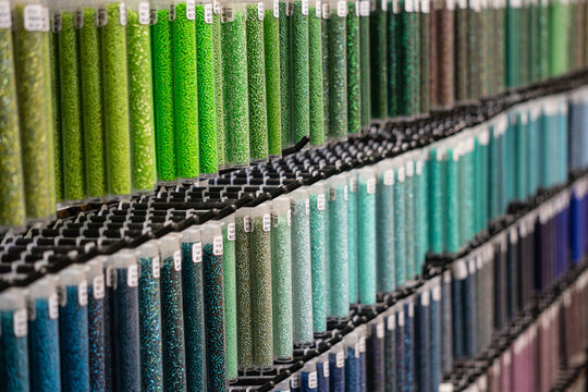 Colorful long containers of seed beads