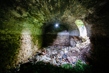 Abandoned empty old dark underground vaulted cellar