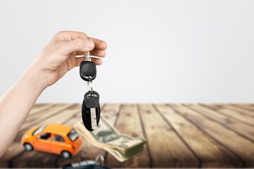 Car salesman gave the keys to the customers, Purchase contract and key delivery.