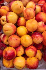 Fresh ripe peaches on the store counter