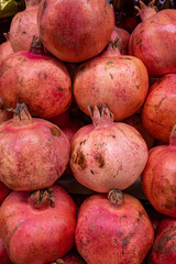 a tray of ripe juicy pomegranates close-up