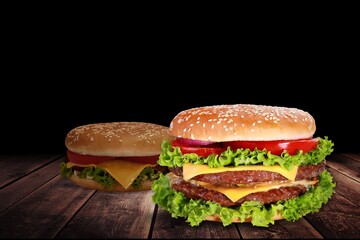Tasty grilled homemade burgers with beef, tomato, cheese on rustic wooden background.