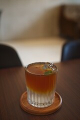 selected focus of iced coffee with soda on a table in a cafe 