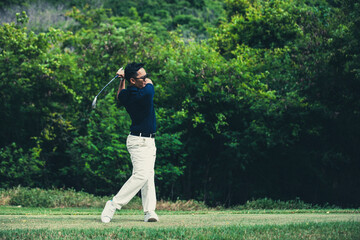 golfer playing golf on a golf course