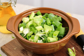 Sliced, chopped spring onions, salad onions, green onions or scallions in a bowl
