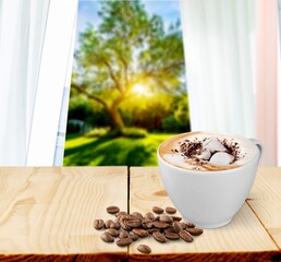 Tasty cold espresso coffee with cold milk foam and sprinkled coffee beans.