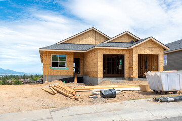 A hilltop new construction home being built in the mountains of Liberty Lake, Washington, USA, a...