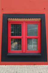 window with red shutters