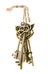 old brass key against a white background