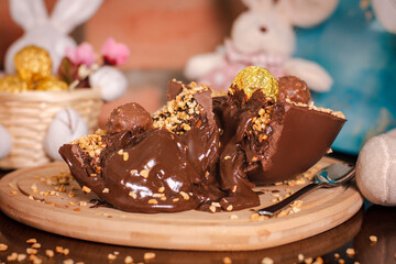 brazilian easter egg with creamy spoon stuffed chocolate bonbon flavor on board