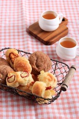Assorted One Bites Mini Bread or Popular as Roti Unyil Venus on White Plate, White Background....