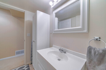 Mirror and a sink in a minimal bathroom