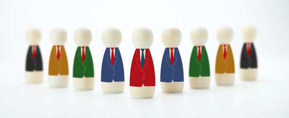 Wooden dolls in suits stand in a group. The concept of leading the organization towards its goals and teamwork.
