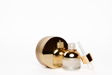 Transparent golden bottle with pipette and hylauronic acid. Top horizontal view copyspace