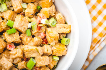 Sizzling Tofu- is deep-fried tofu sautéed in garlic, onion, pepper with cream sauce.