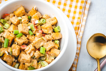 Sizzling Tofu- is deep-fried tofu sautéed in garlic, onion, pepper with cream sauce.