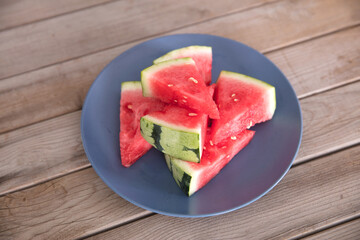 Watermelon cut into small pieces on a plate
