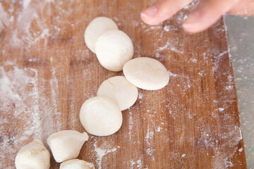 Fototapeta na wymiar Knead the white dough