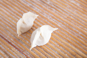 Fototapeta na wymiar Two freshly made dumplings