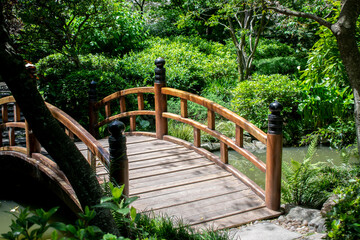 Old wooden bridge in a Japanese garden