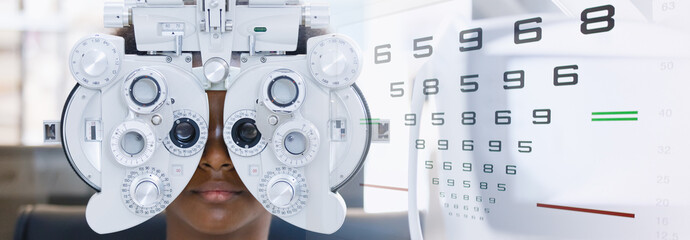 Young woman african american eye exam with diagnostic ophthalmology in optical clinic, double...