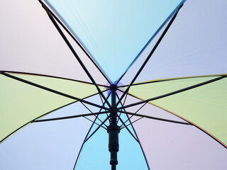 under of open colorful umbrella