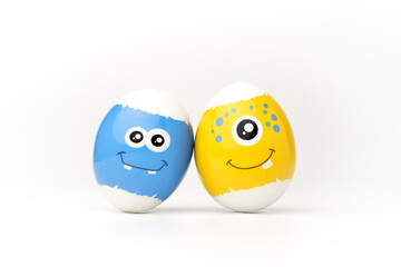 Blue and yellow festive easter eggs with emoticons