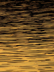 gold water wave with light at sunset
