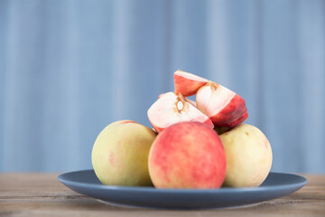 Clean fresh peaches on a plate